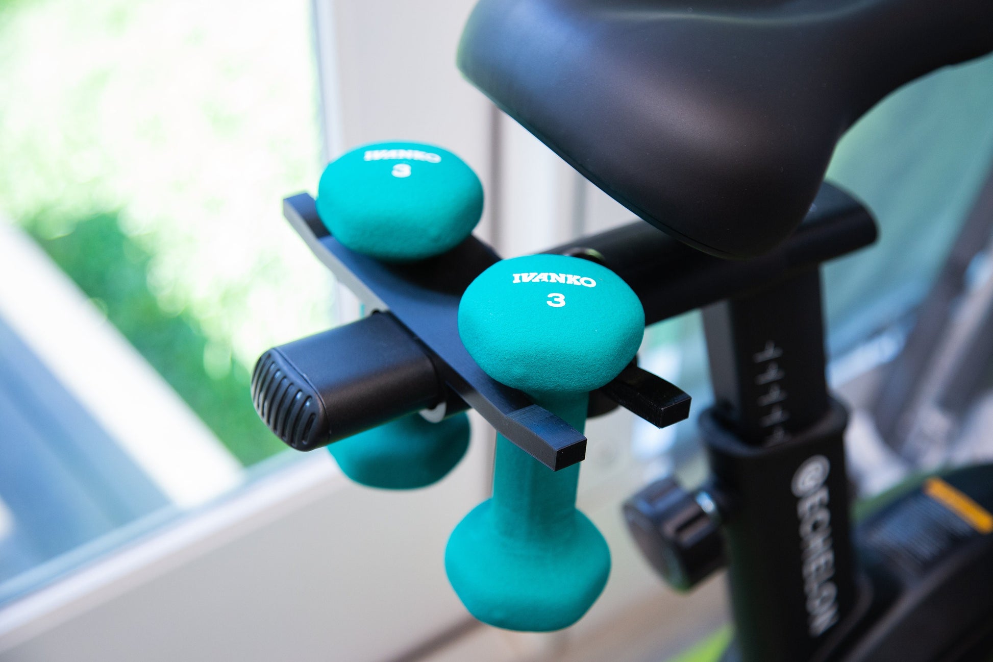 Exercise bike dumbbell online holder